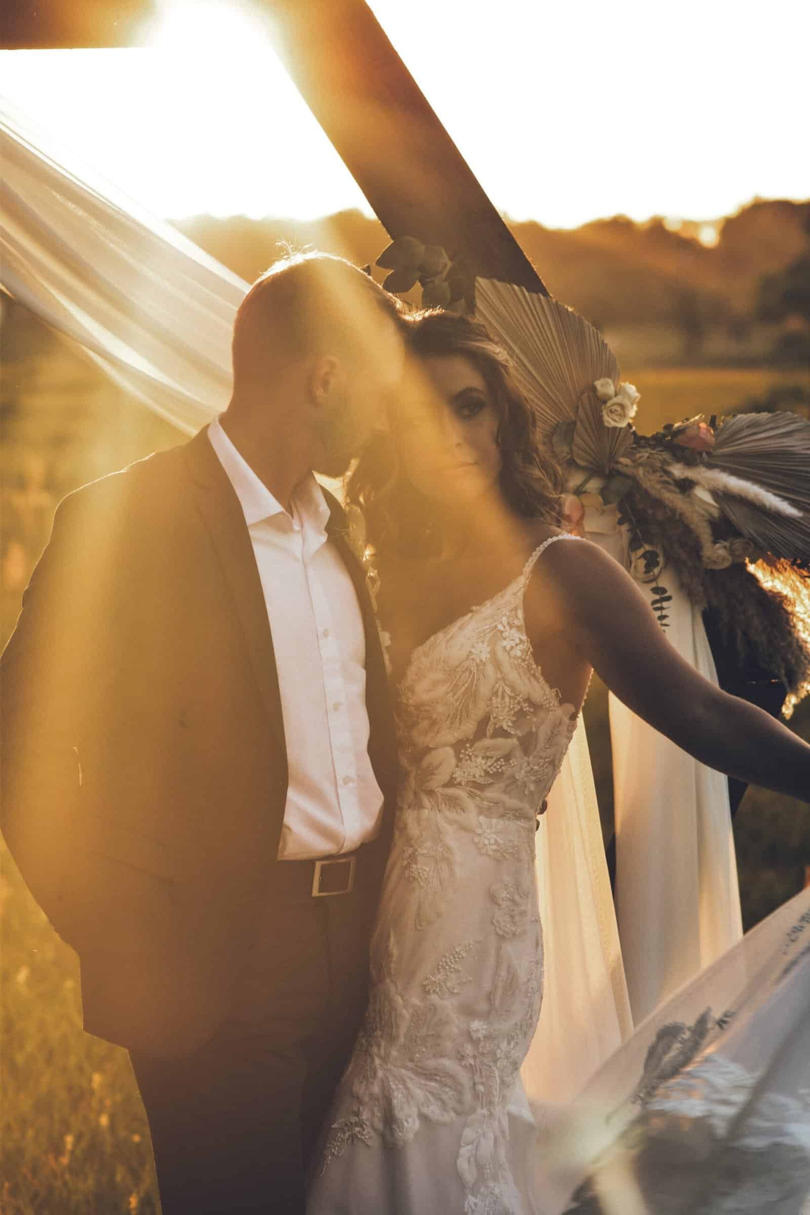 Octagon Wooden Wedding Ceremony Arch with White Draping and Pampas Grass Florals