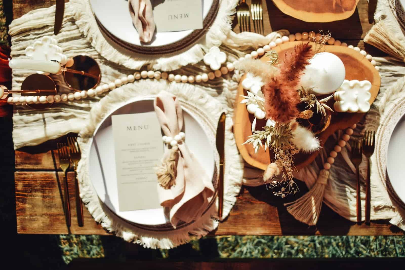 Fall Boho Reception Tablescape with Burnt Orange Florals and Gabro Event Services Linens