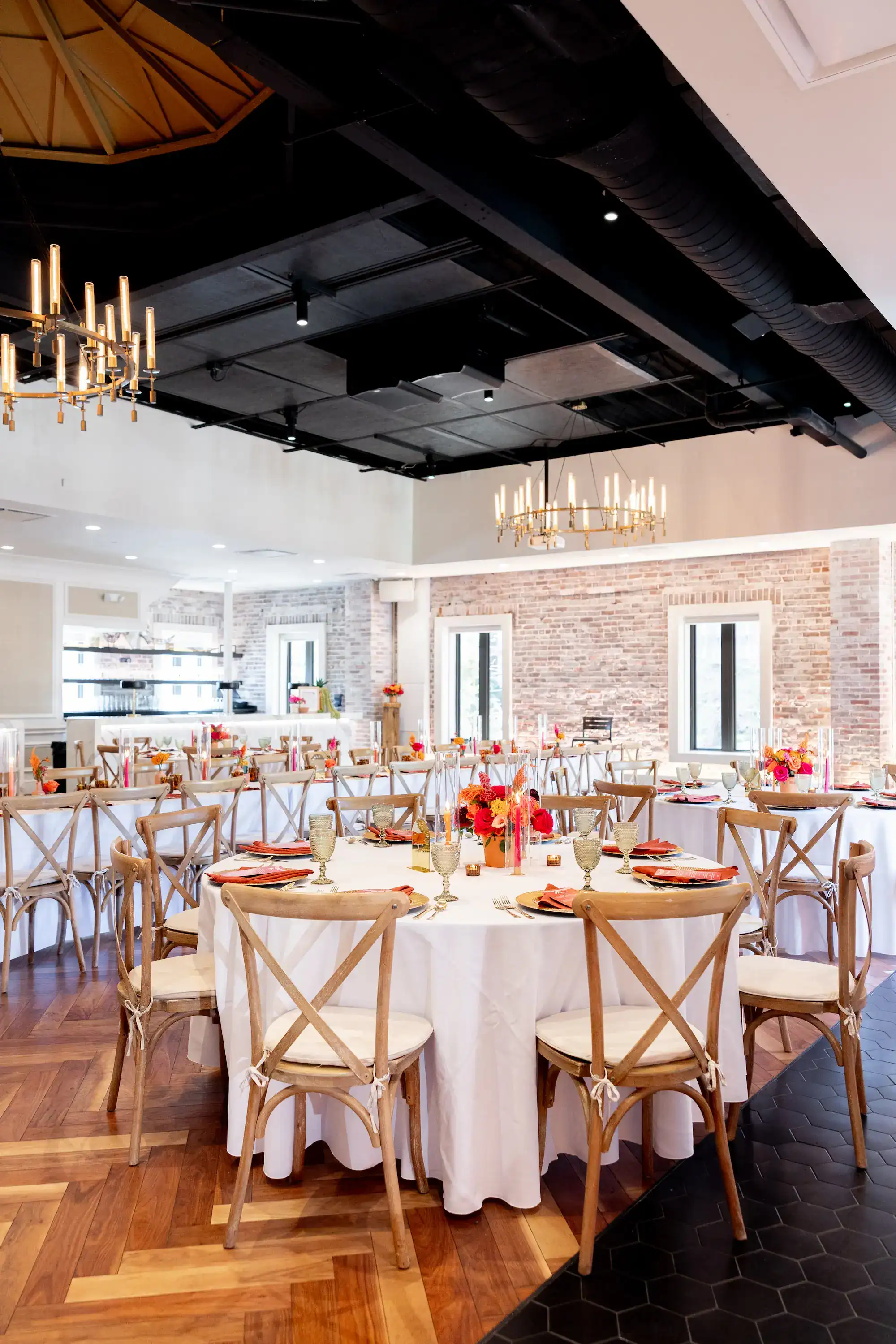 Vibrant terracotta, pink, and orange rooftop wedding reception at Red Mesa Events in St. Pete