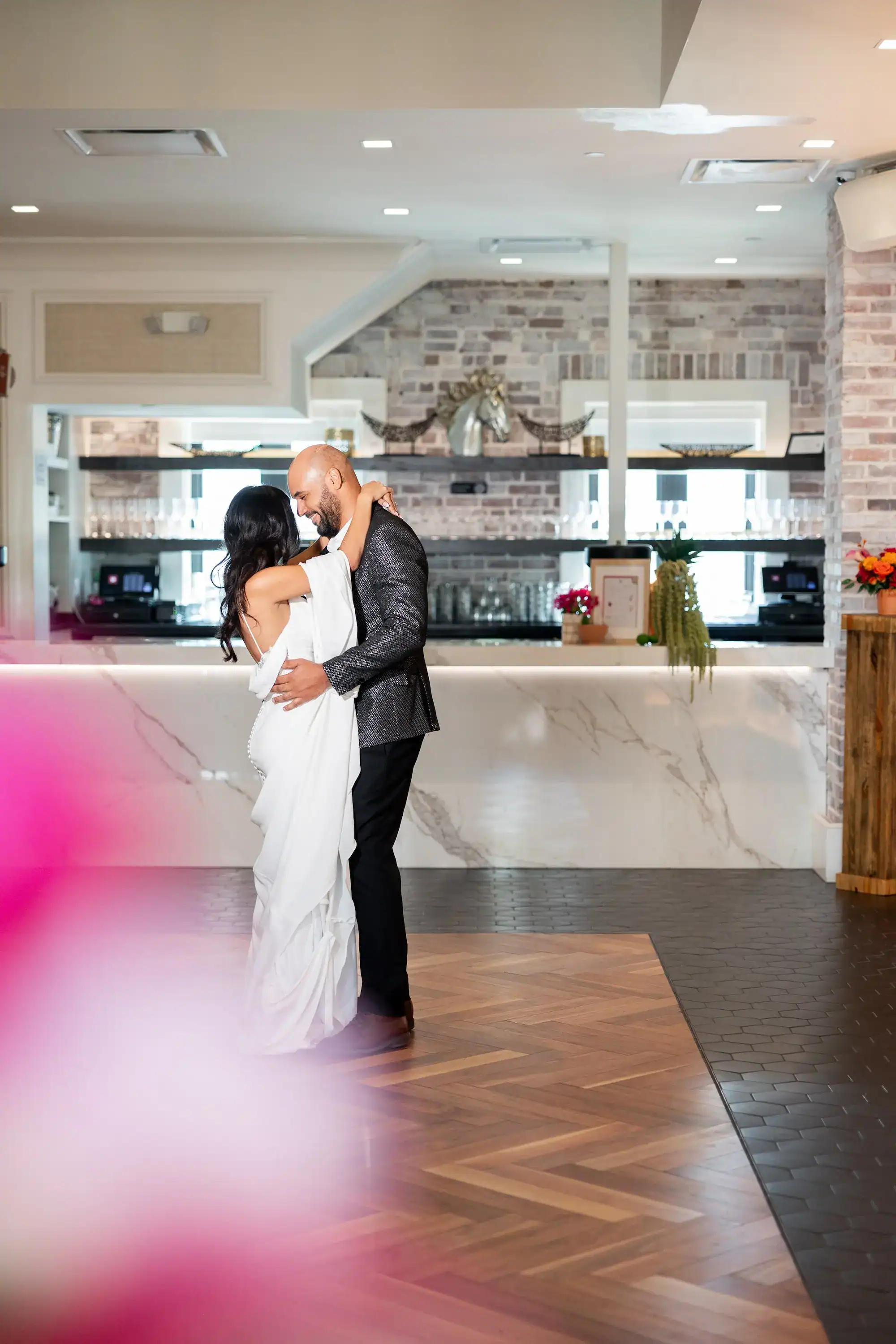 Newlyweds Sharing Their First Dance during Ballroom Reception at Red Mesa Events