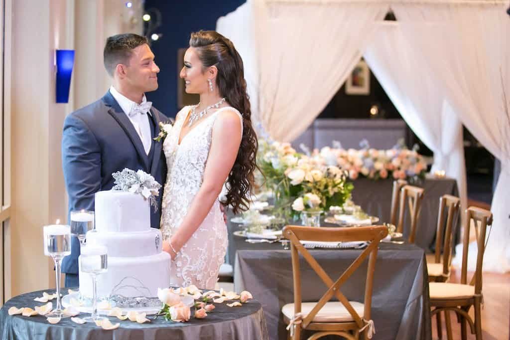 Bride and Groom Romantic Wedding Reception Portrait by Three Tier Marble Cake at Renaissance Tampa International Plaza