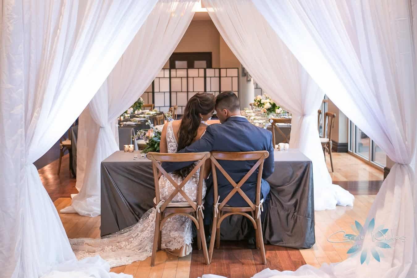 Sleek contemporary wedding ceremony setup at Renaissance Tampa International Plaza featuring metallic gold Chiavari chairs by Gabro Event Services
