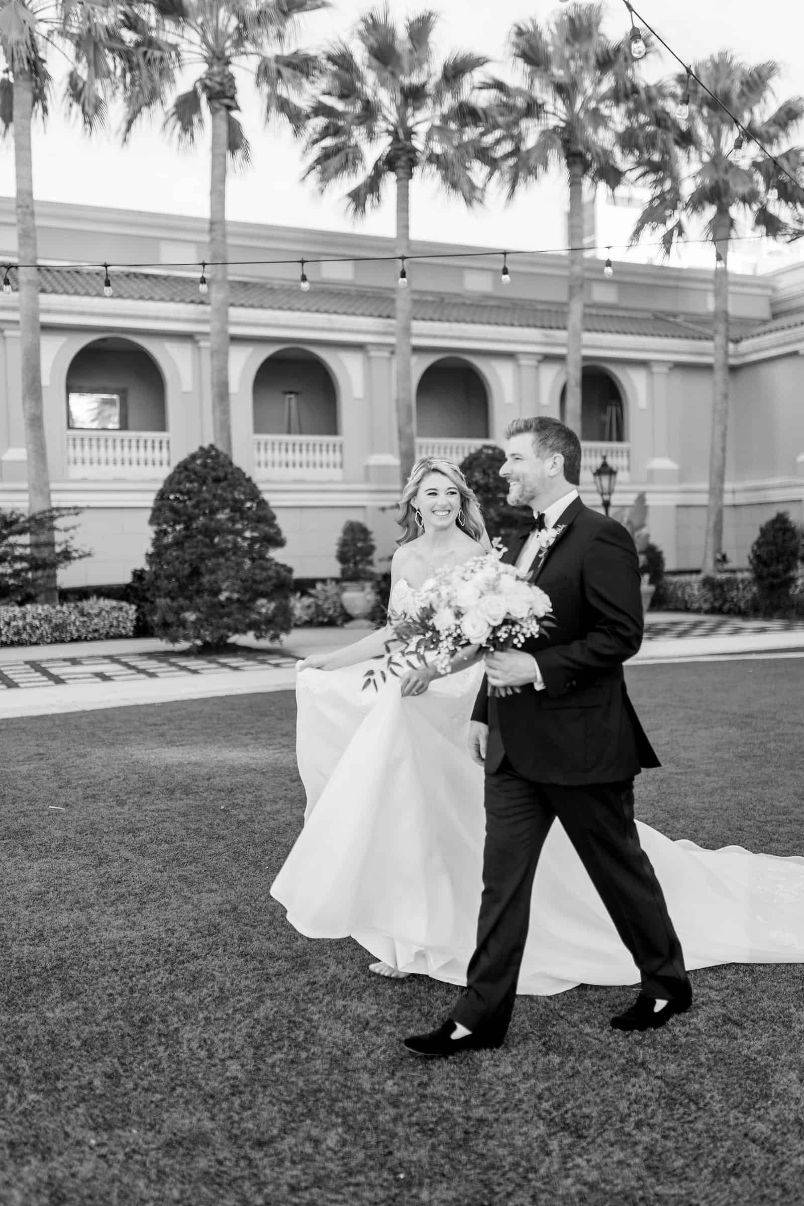 Opulent ballroom wedding reception at The Ritz-Carlton Sarasota featuring Gabro Event Services luxury feasting tables and chairs