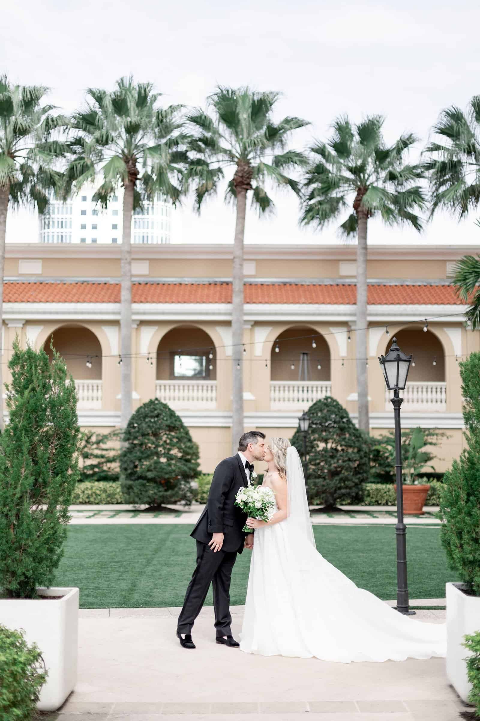 Warm amber and candlelit architectural ballroom lighting casting romantic glows across The Ritz-Carlton Sarasota ballroom