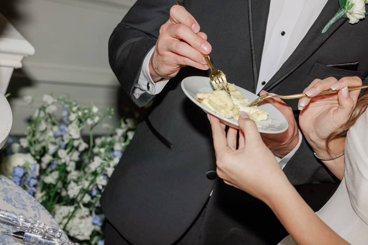 Evening ballroom reception dancing under warm crystal chandelier lighting