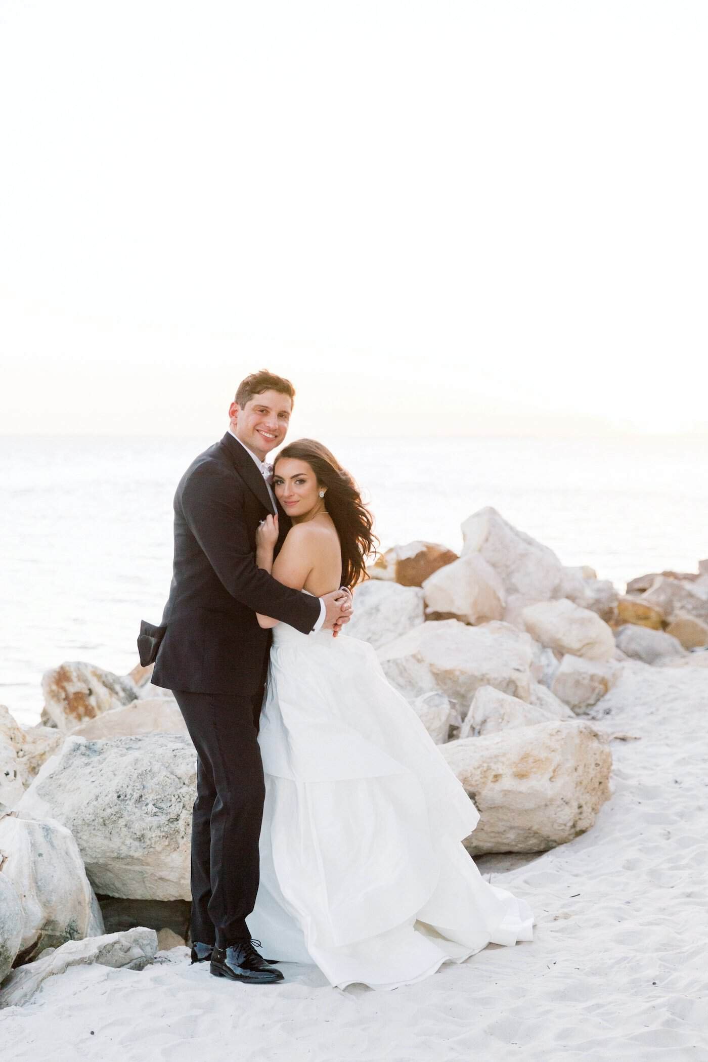 Bride and Groom Romantic Sunset Waterfront Wedding Portrait on Tampa Bay by Cornelia Z Photography