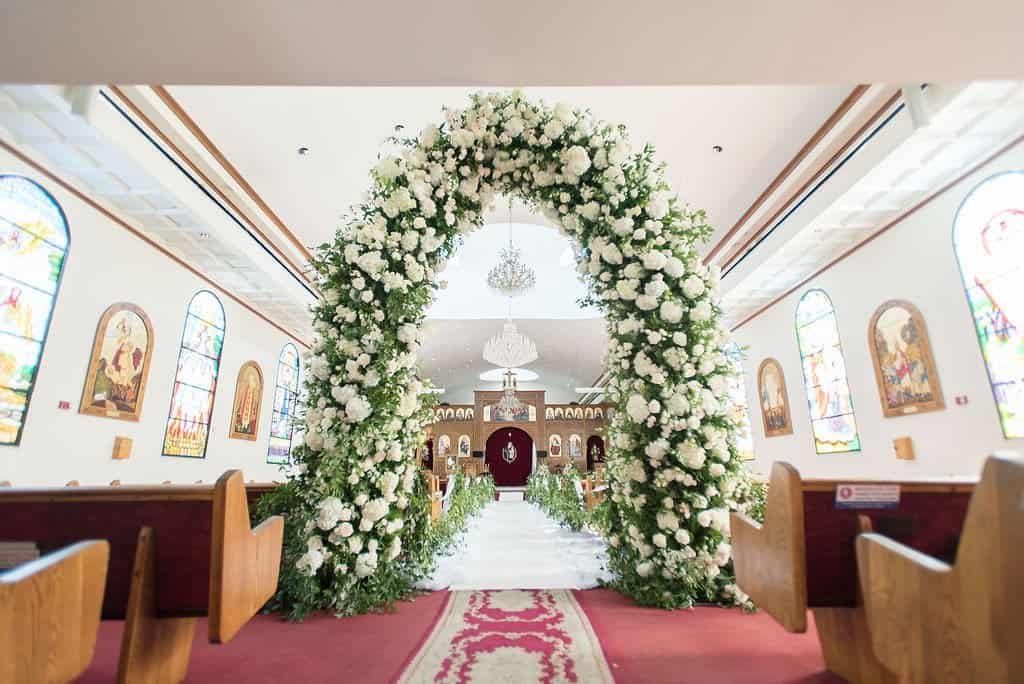 Church Entrance Floral Arch with White Hydrangeas and Greenery by Gabro Event Services at St George Coptic Church