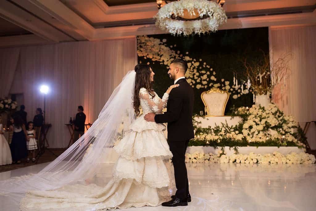 Bride and Groom Romantic First Dance in Sandpearl Resort Grand Ballroom by Kristen Marie Photography