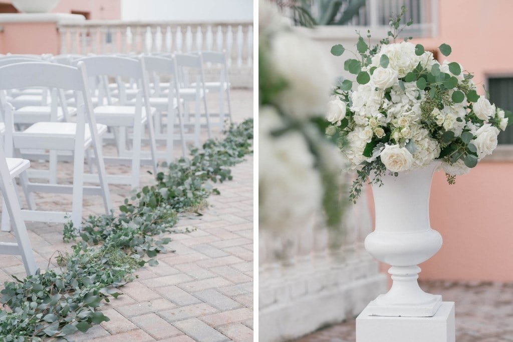 Lavish round reception tables with gold Chiavari chairs, cascading white hydrangeas and greenery centerpieces, and glowing candlelight