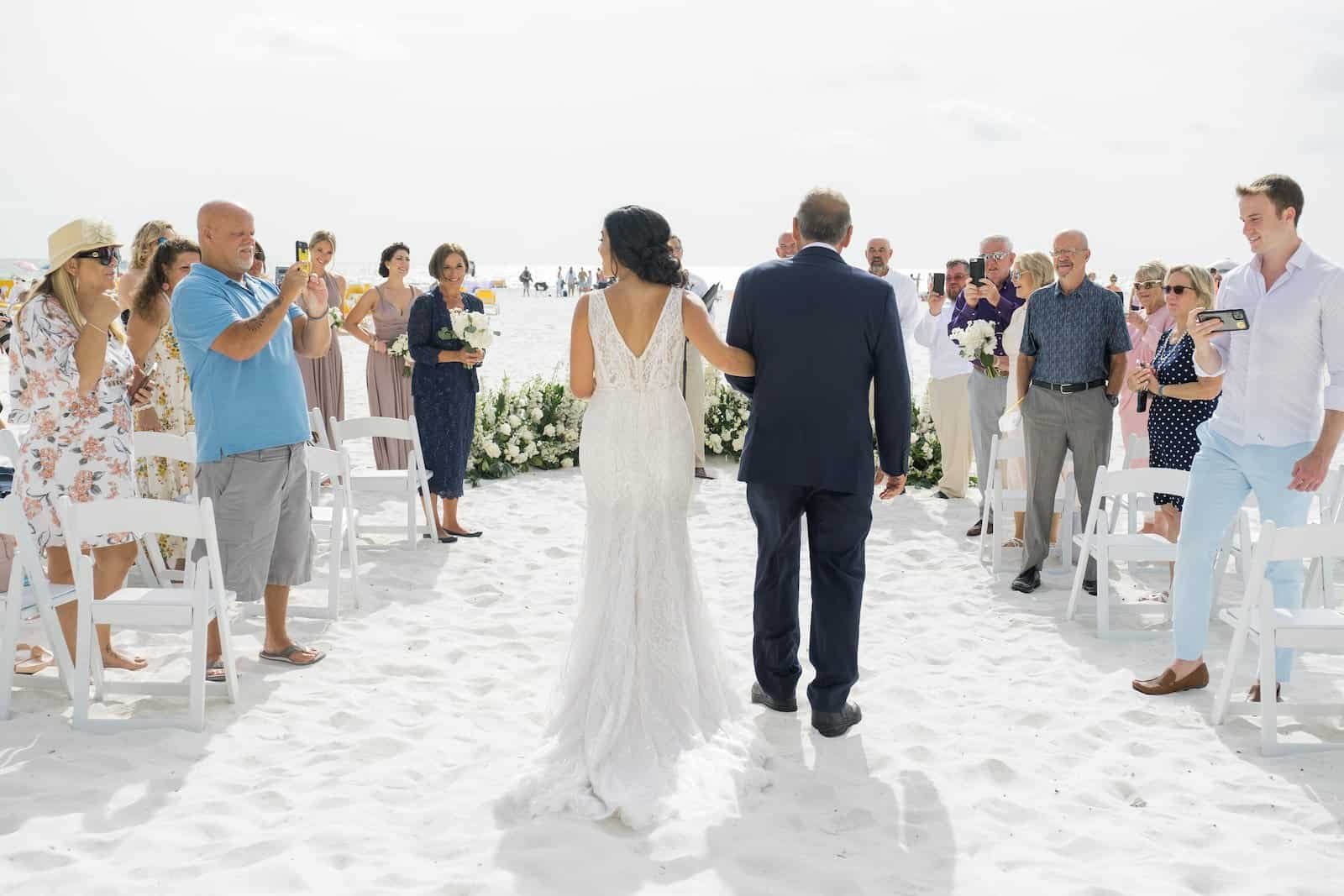 Waterfront Ceremony Lawn with White Folding Chairs and Lush Arch overlooking Clearwater Beach