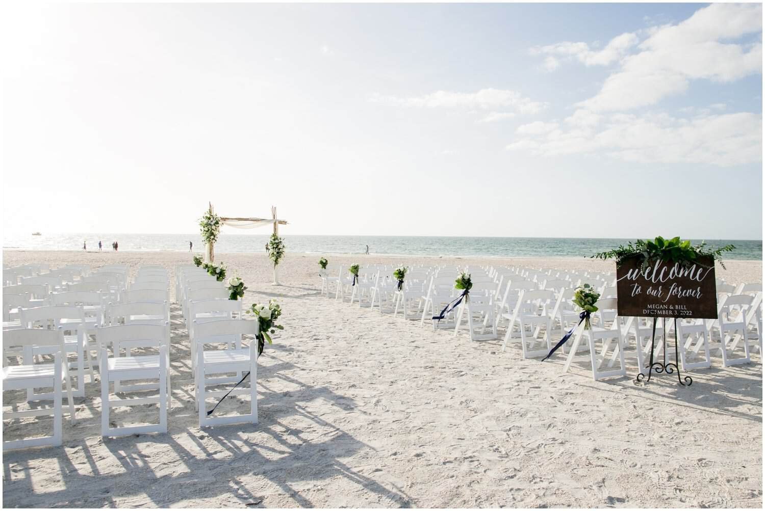 Reception dinner banquet tables set with coastal blue linens and elegant place settings at Sheraton Sand Key