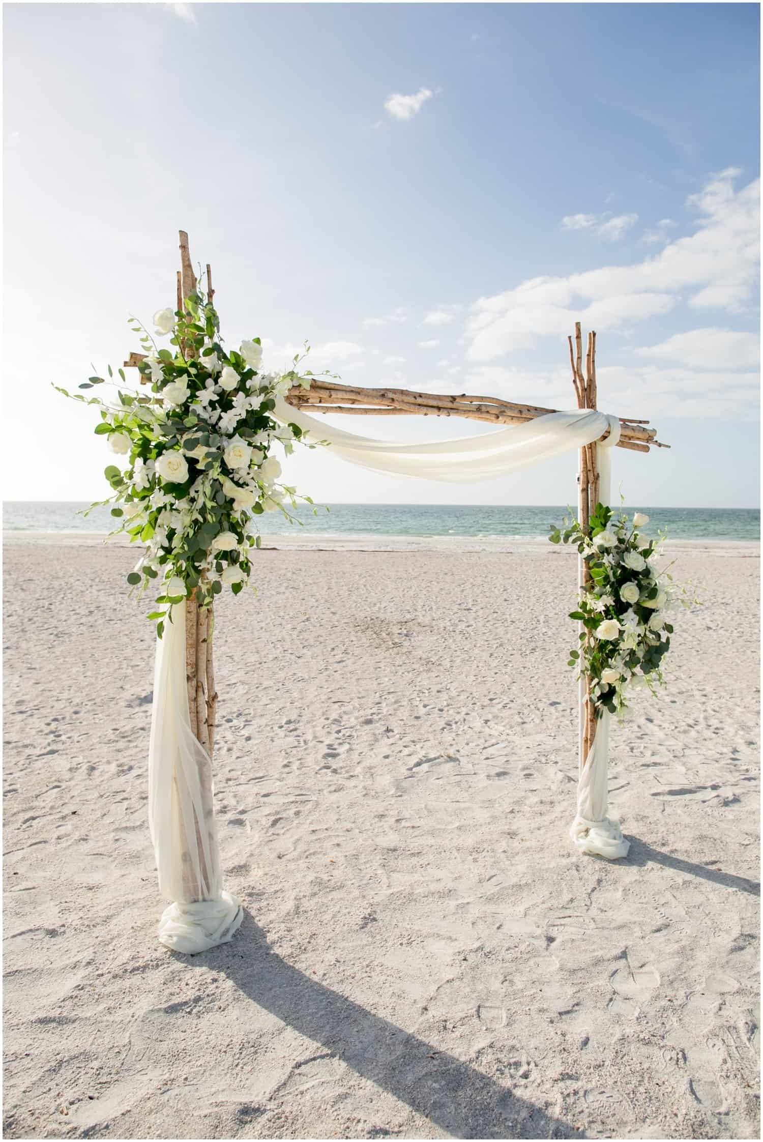 Delicate floral centerpieces, floating candles, and tailored linens by Gabro Event Services