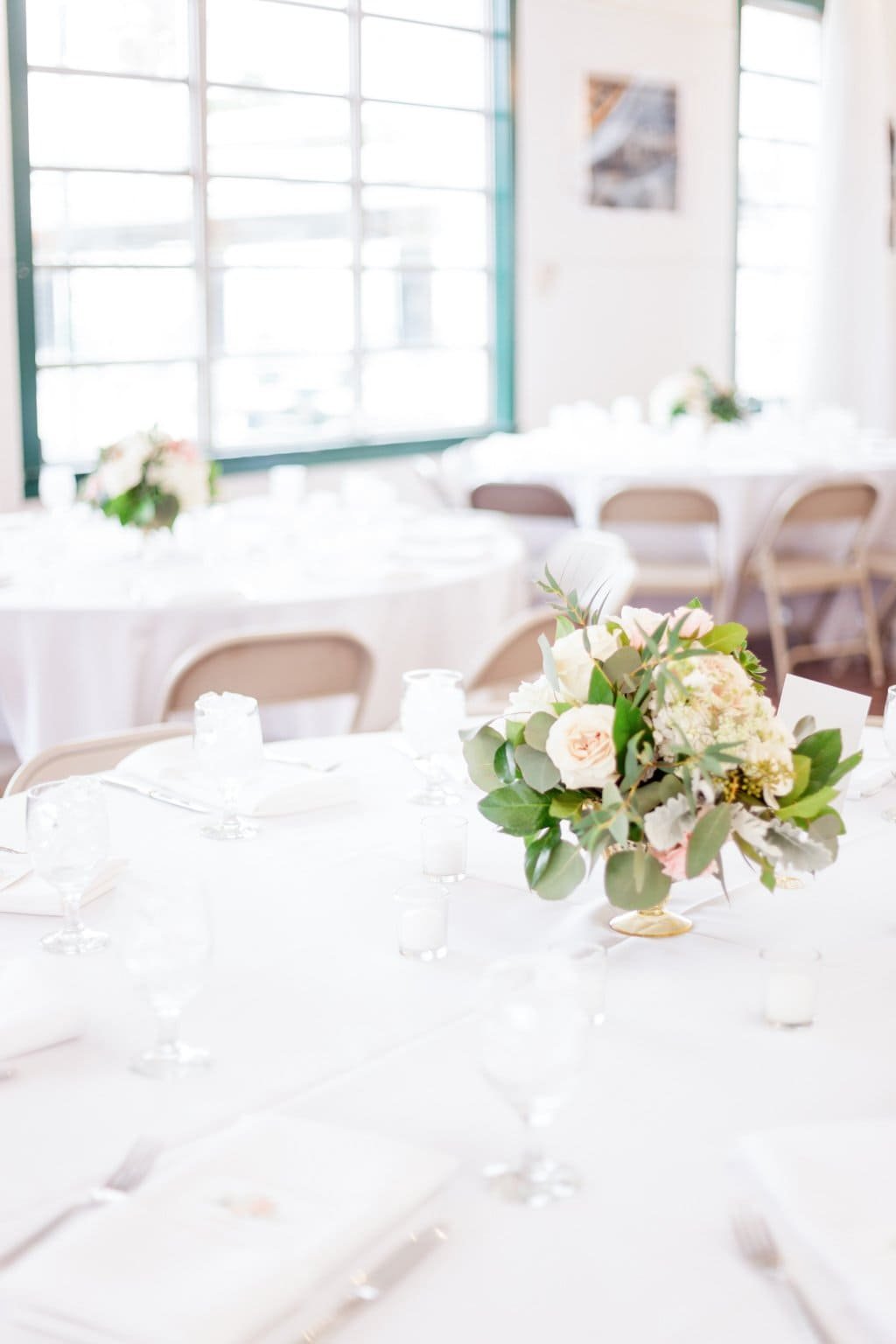 Indoor Reception Feasting Tables Styled with Gabro Event Services Linens and Table Rentals
