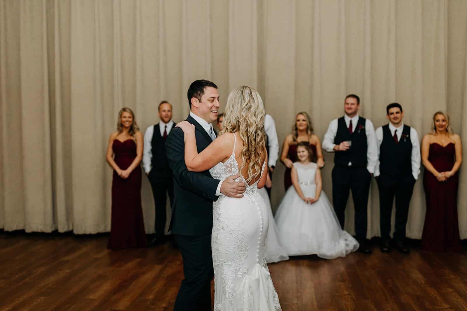 Couple First Dance Beneath Dramatic Ceiling Fabric Draping and Uplighting by Gabro Event Services
