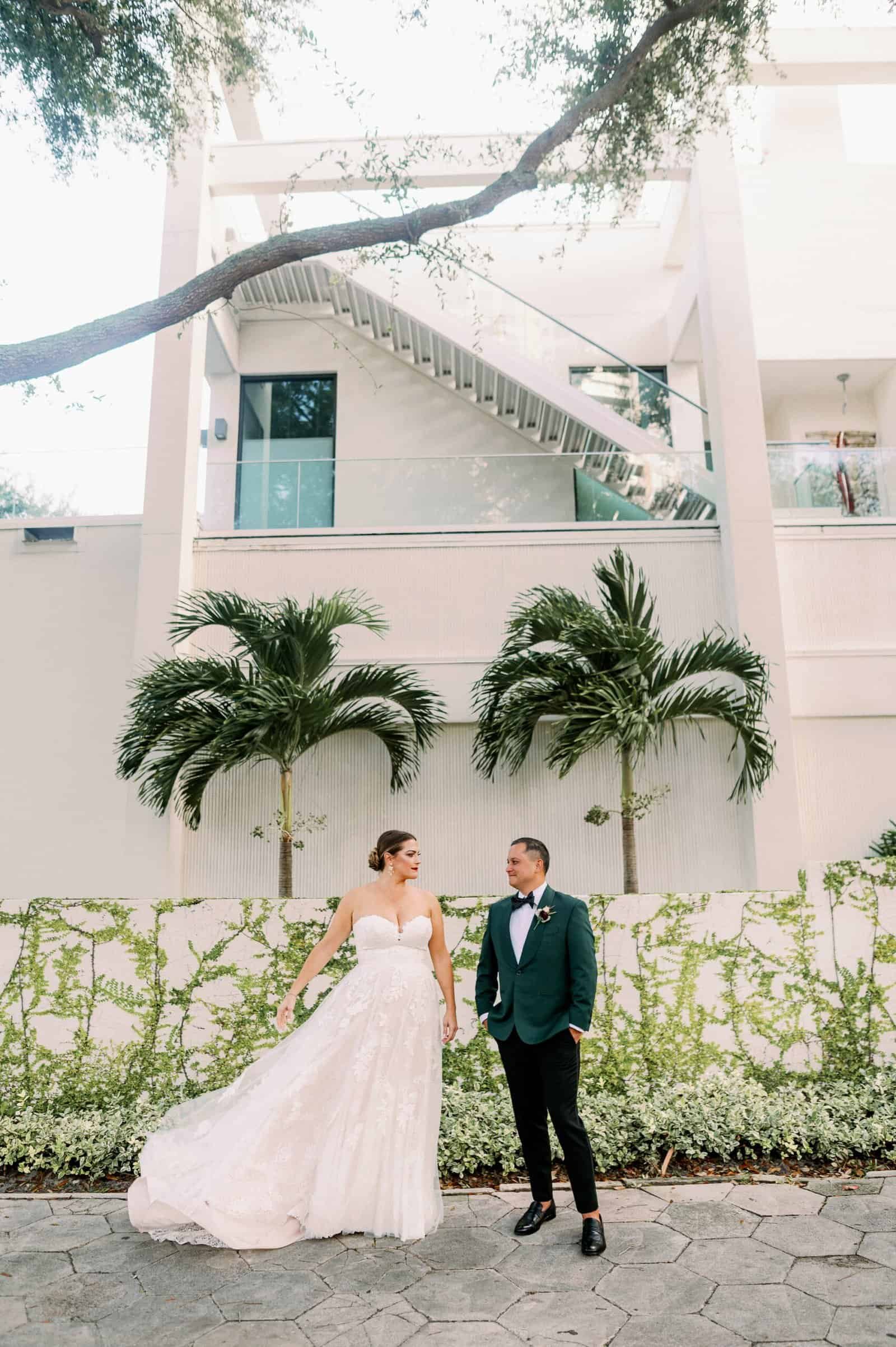 Bride and groom romantic wedding portrait along downtown St. Petersburg exposed brick alleyway