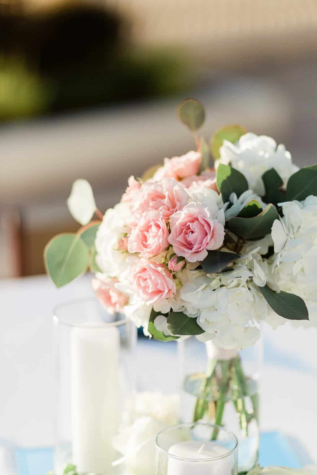 Romantic Candlelit Garden Tablescape with Gold Chargers and Tropical Floral Centerpieces