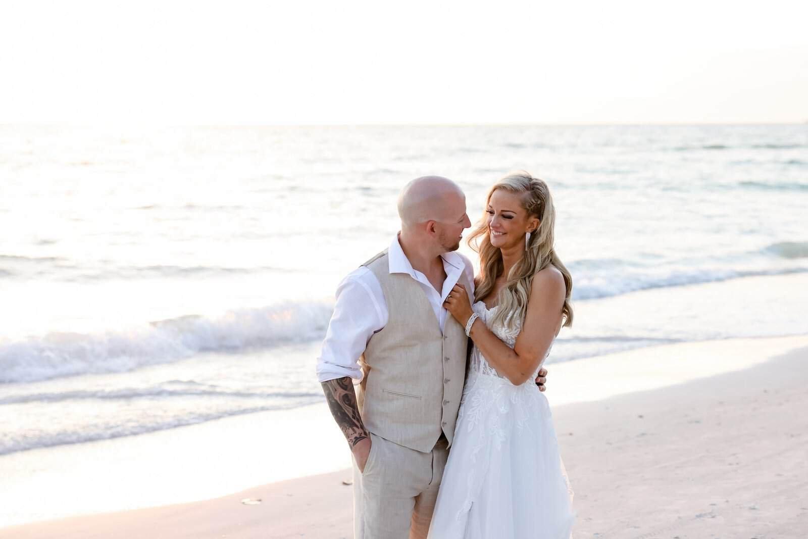 Bride and Groom Sunset Golden Hour Embrace on the Sands of Sunset Beach House