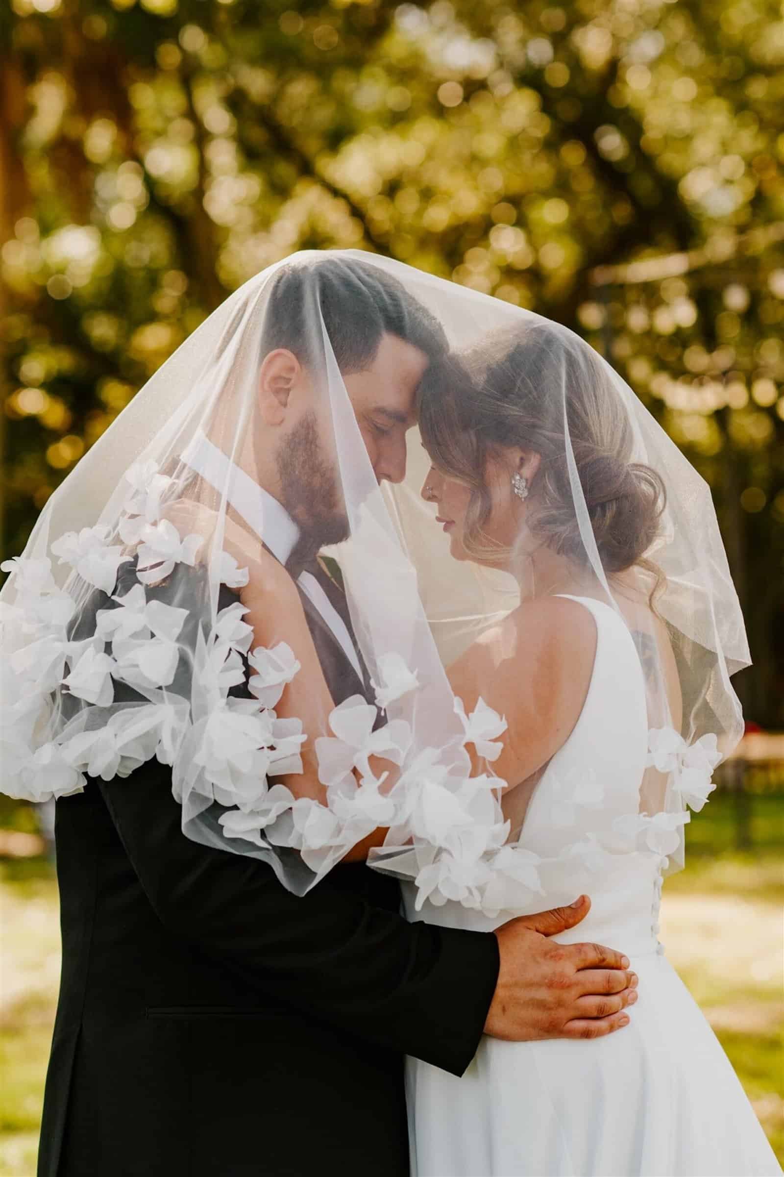A wedding guest enjoying a hand-rolled cigar during a Cuban-inspired outdoor reception.