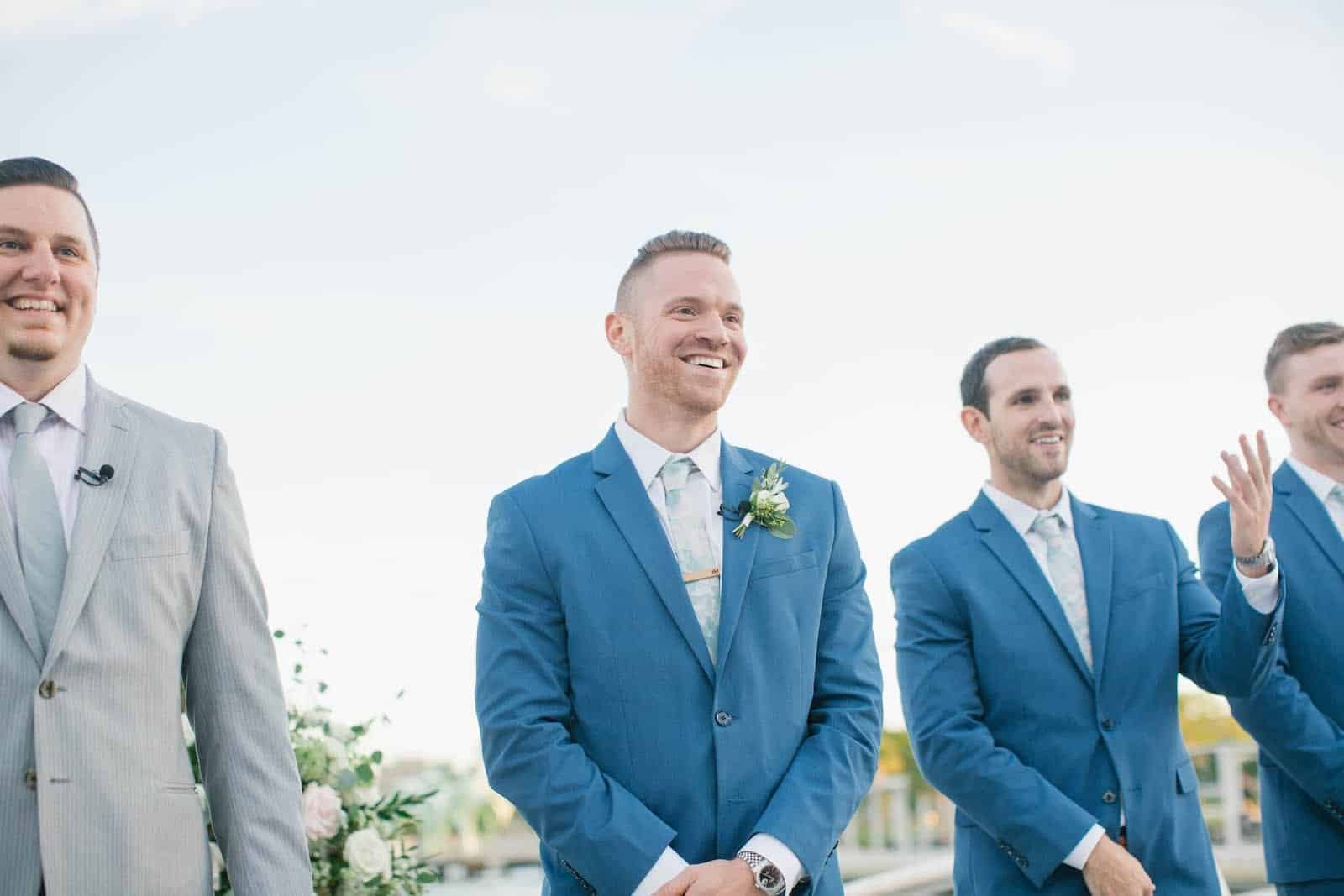 A stunning waterfront ceremony setup at Tampa River Center during a glowing sunset.