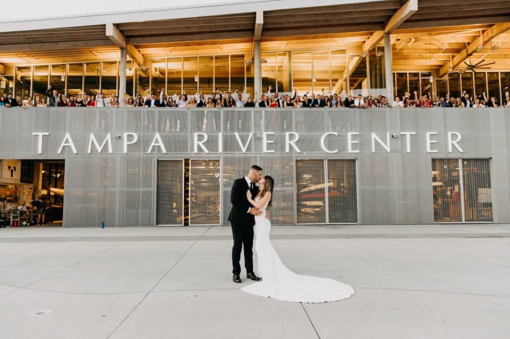 A lively wedding reception dance floor filled with guests celebrating the happy couple.