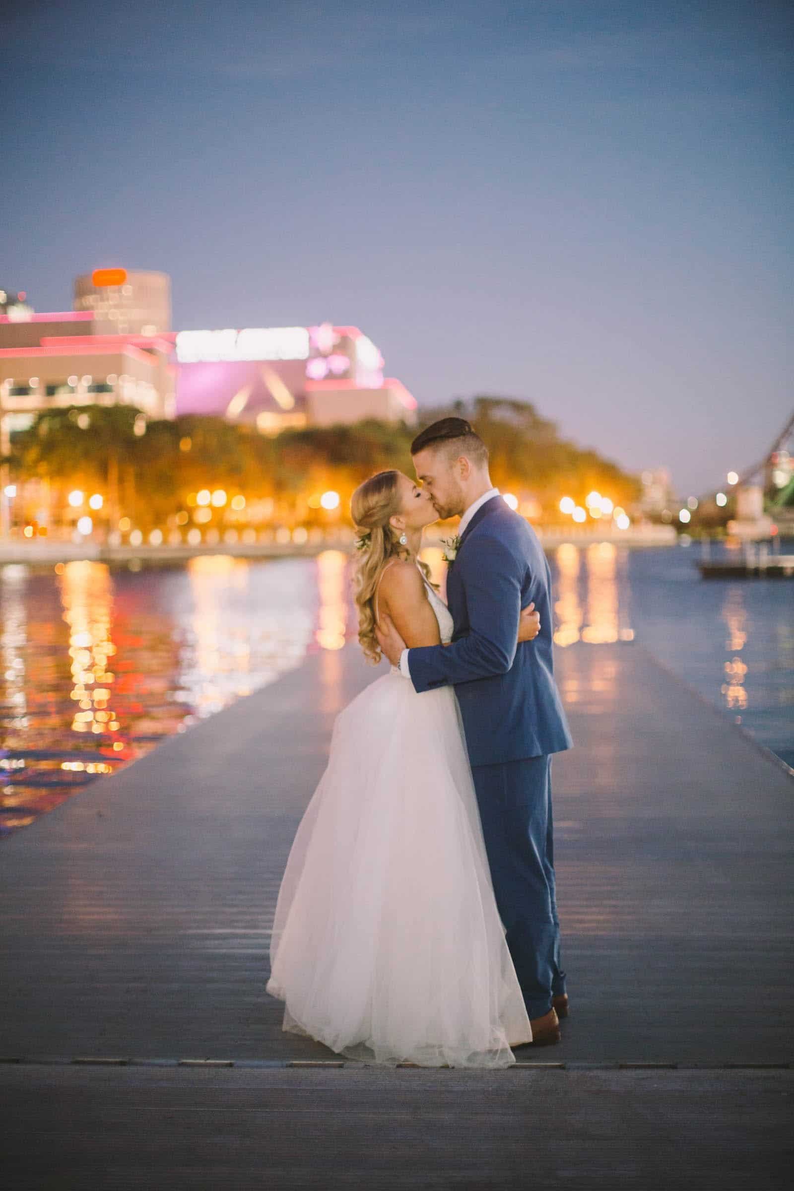 The happy couple sharing their first dance on a polished dance floor.