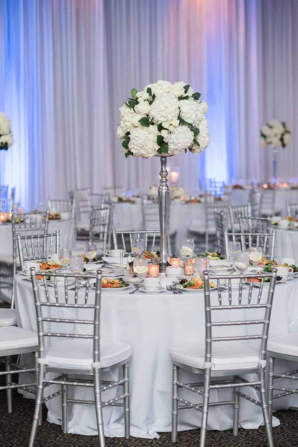 Four Tier White Wedding Cake by Publix with Navy Blue Ribbon and Silver Monogram Topper