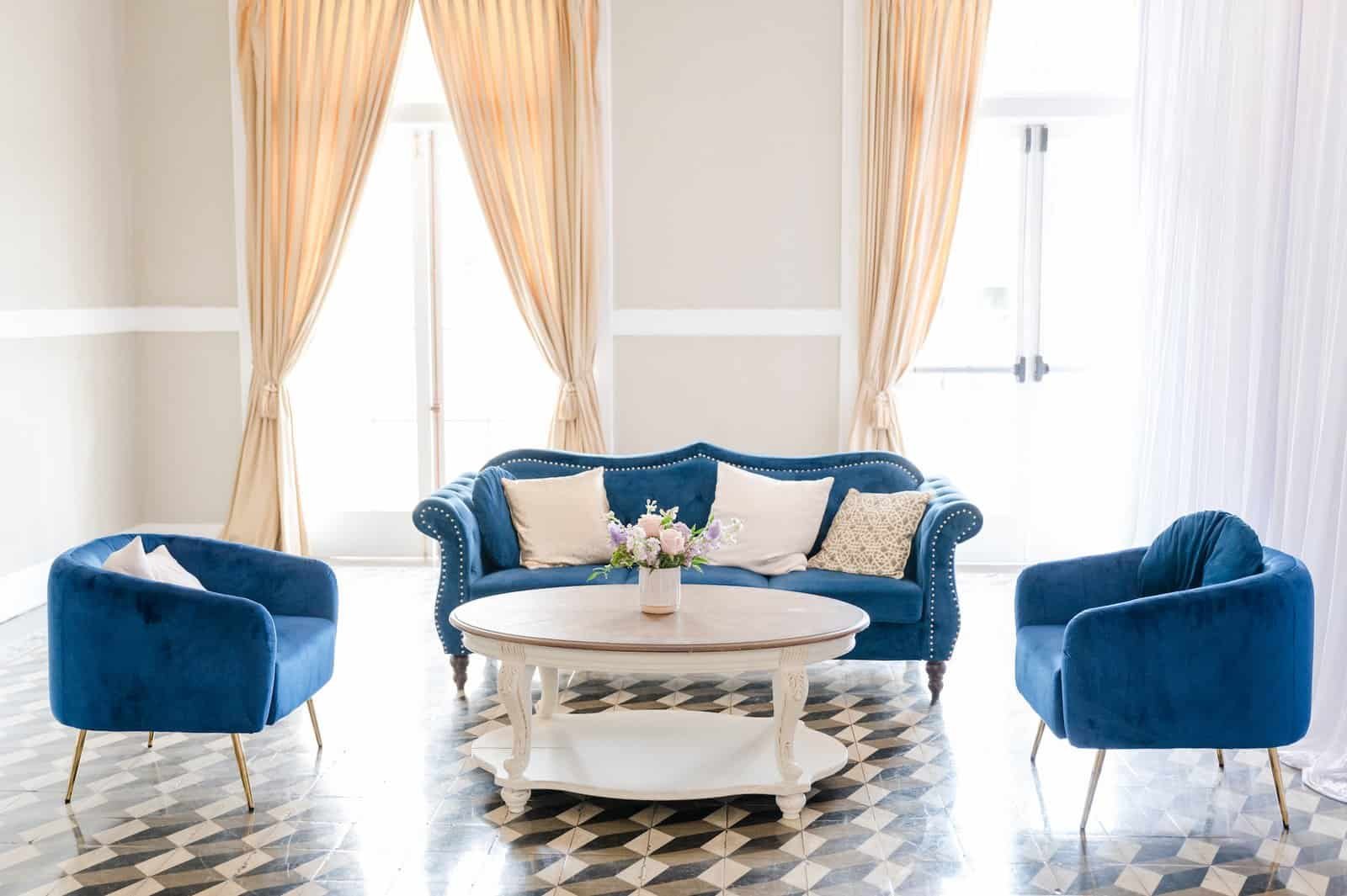 Modern velvet lounge vignette and illuminated poolside bar at Hotel Alba