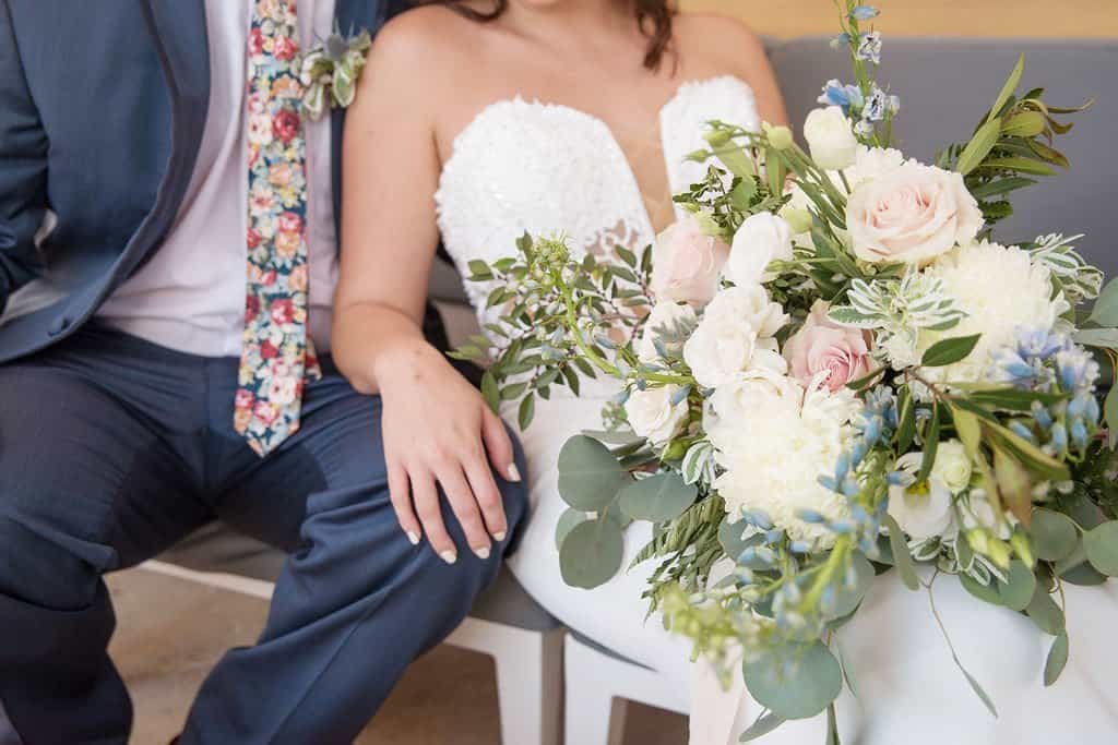 Romantic golden hour bride and groom portrait along the waterfront pier at The Godfrey Hotel in Tampa