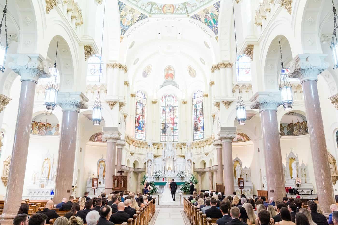 The happy couple sharing a romantic first dance in their beautifully decorated waterfront ballroom.