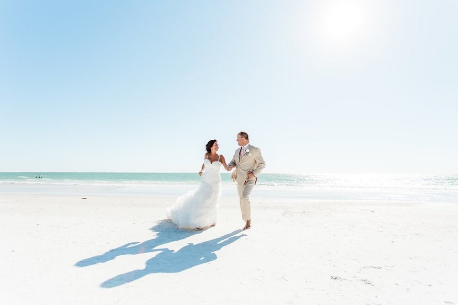 Bride in Fitted Lace Gown and Groom in Khaki Suit on Siesta Key Beach