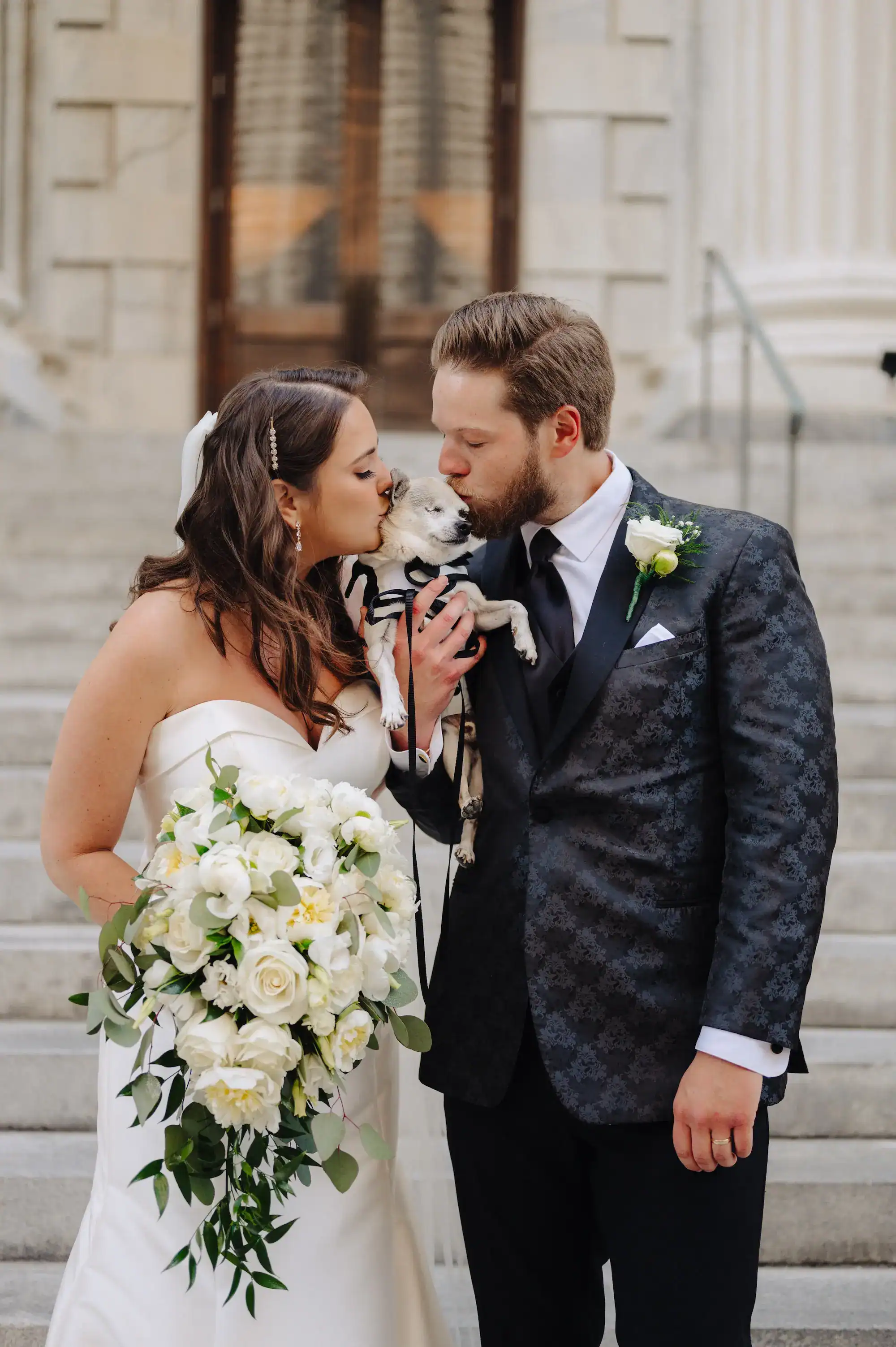 Bride and Groom with their Senior Dog Ring Bearer in Tuxedo Harness at The Vault Wedding