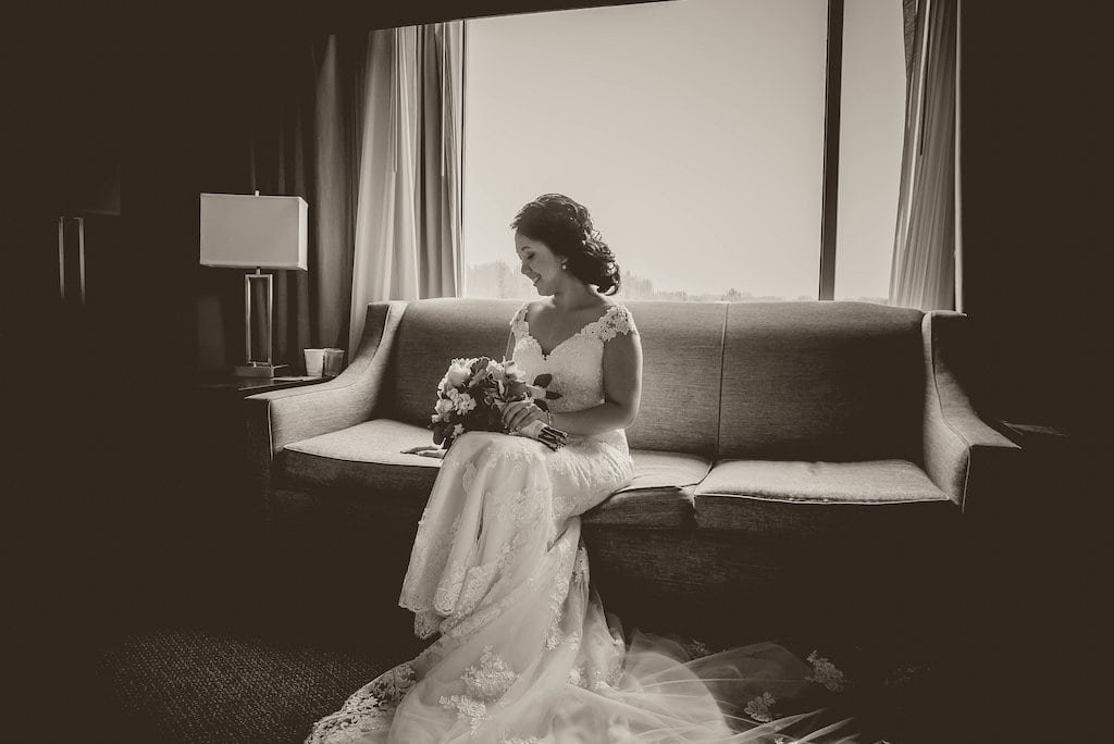 The bride wearing a traditional Vietnamese ao dai during an emotional first look.