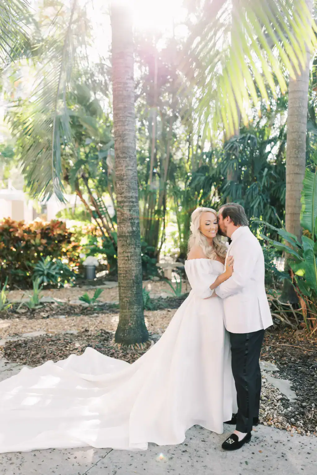 Bride and groom first look portrait outside The Vinoy with Monique Lhuillier wedding gown