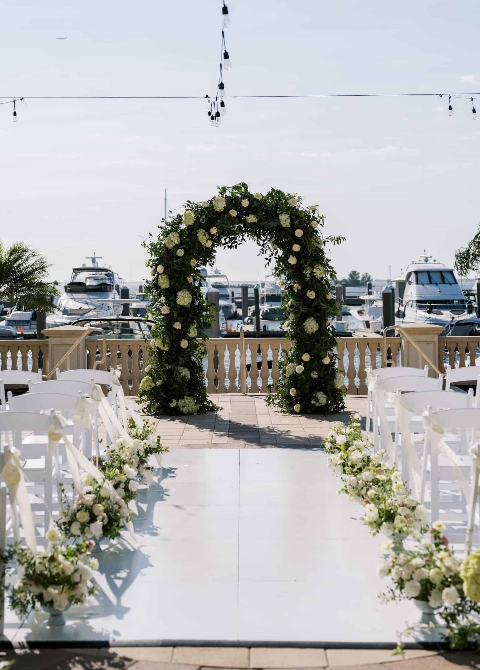 The bride and groom laughing together during their coastal-themed reception in Tampa.