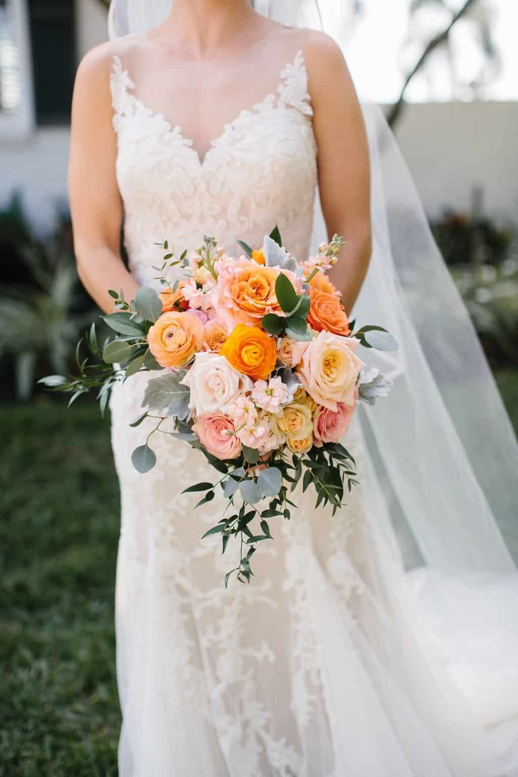 A stunning outdoor reception setup overlooking the St. Petersburg waterfront at golden hour.