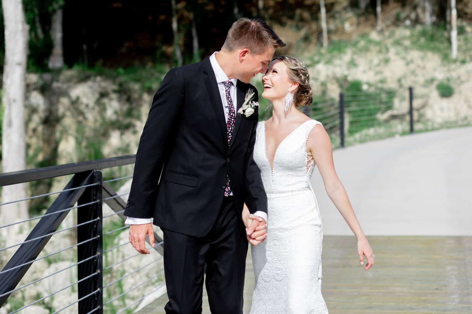 Custom wooden ceremony arbor set against the limestone cliffside quarry backdrop at White Rock Canyon in Bushnell, FL