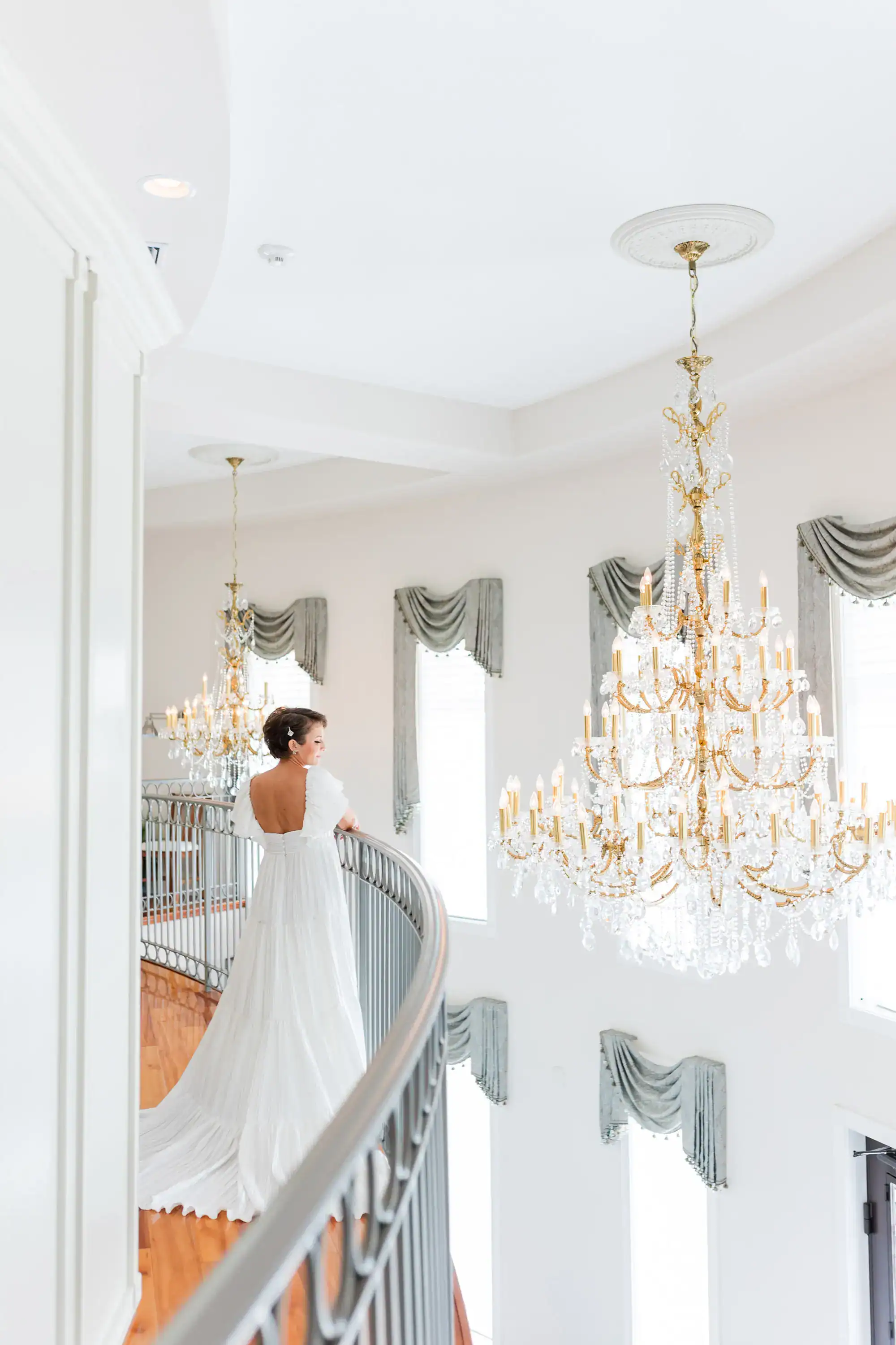 An outdoor ceremony space at Whitehurst Gallery with lush tropical florals and architecture.