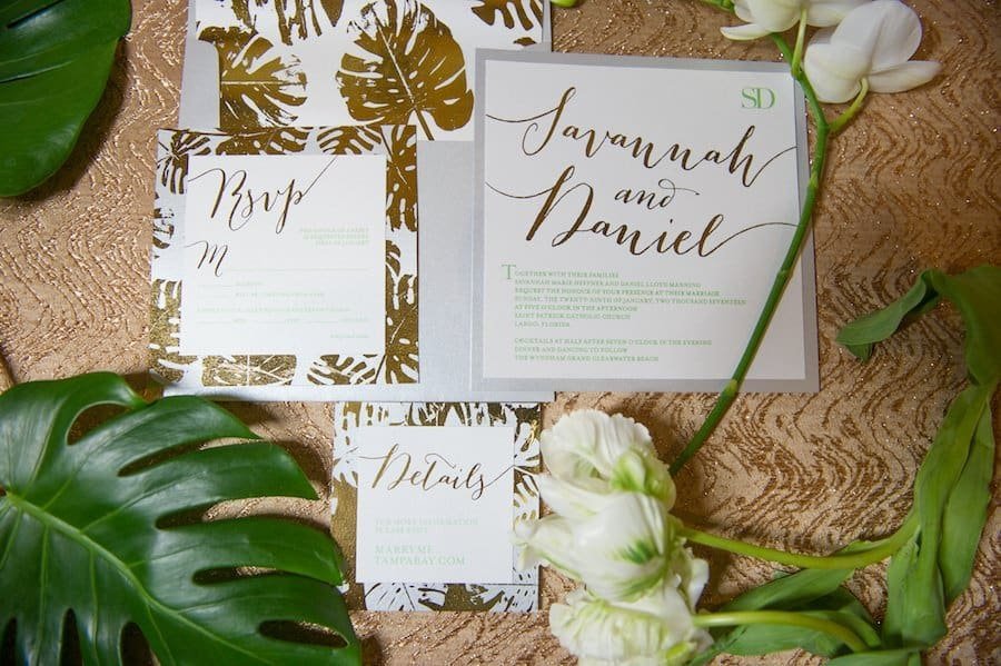 Opulent gold and white wedding ceremony setup in the grand ballroom at Wyndham Grand Clearwater Beach