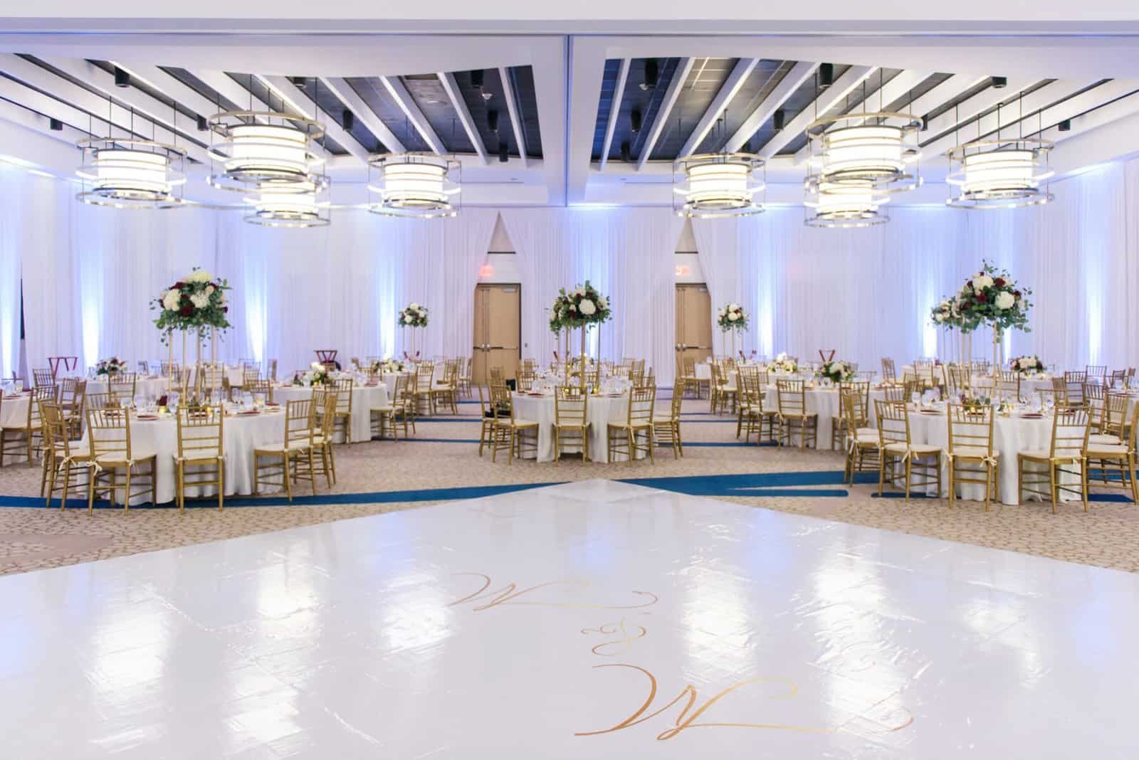 White monogram dance floor in the draped ballroom at the Wyndham Grand Clearwater Beach