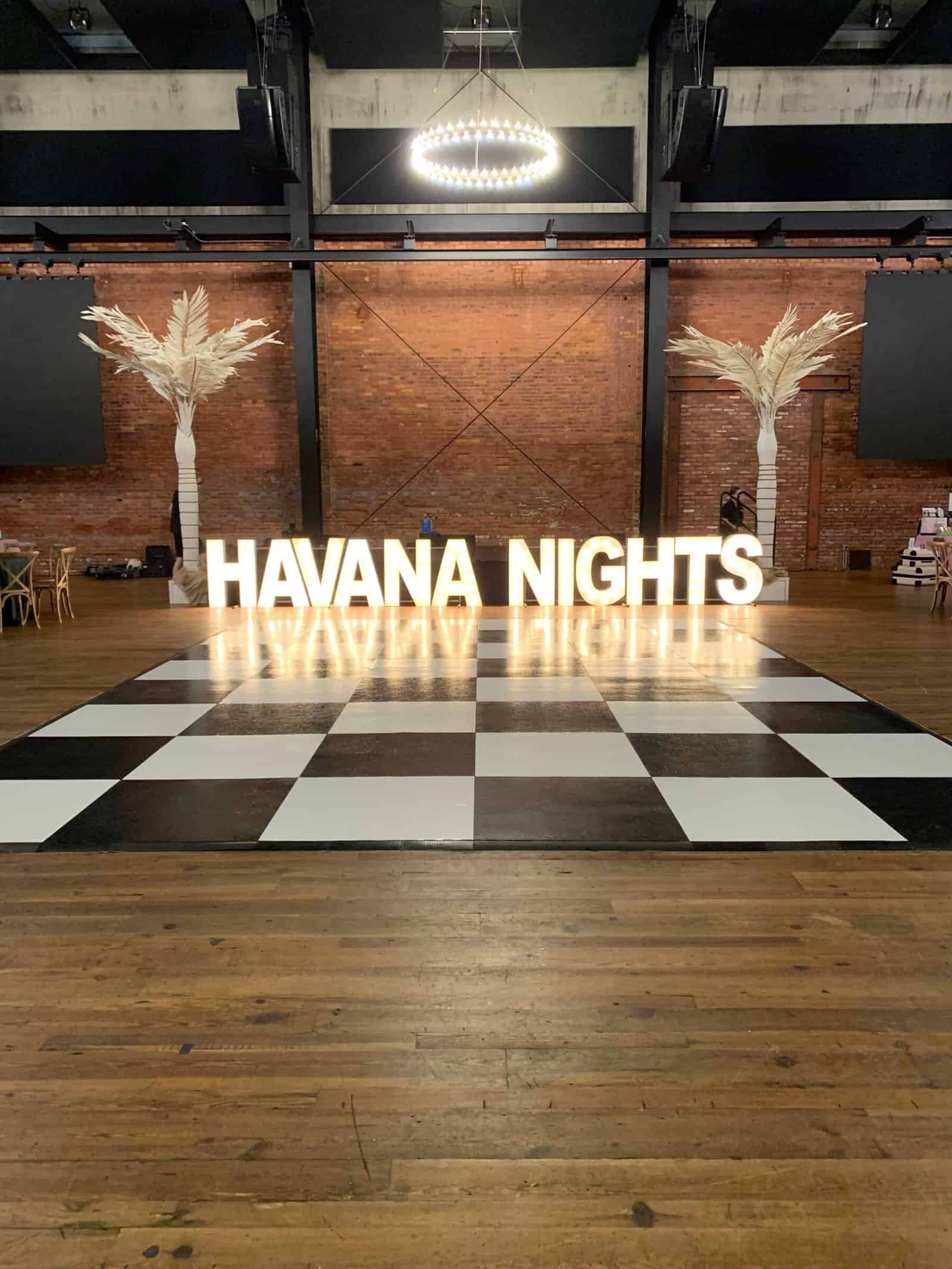 Transformational ceiling draping and production lighting by Gabro Event Services at Armature Works