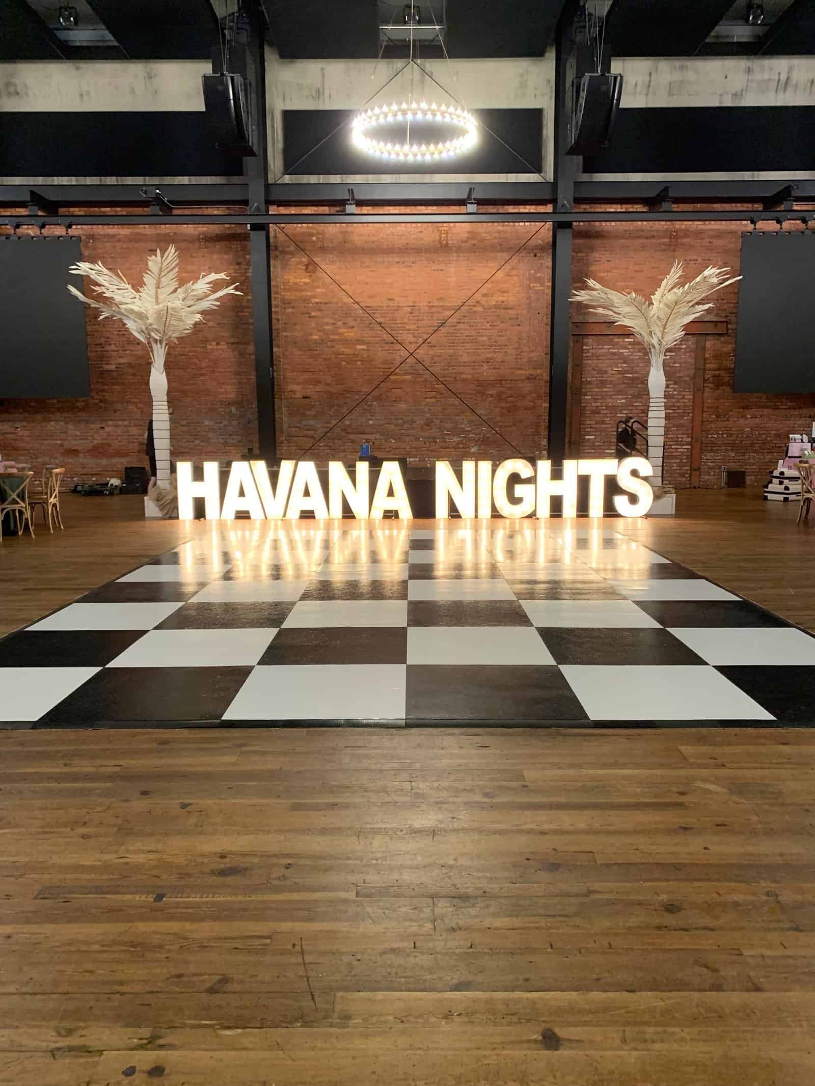 Transformational ceiling draping and ambient uplighting for corporate gala at Armature Works Tampa